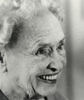 Helen Keller as an older woman, smiling widely