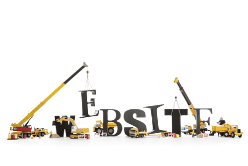 letters spelling out WEBSITE being arranged by toy cranes