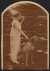 Thumbnail of Photograph of Helen Keller standing outside with a dog