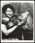 Thumbnail of Photograph of Helen Keller with her arms around the head and neck...