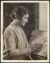 Thumbnail of Photograph of Helen Keller touching a bas-relief tile.