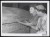 Thumbnail of Photograph of Helen Keller touching a tomb with Polly Thomson bes...