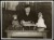 Thumbnail of Photograph of Helen Keller using a braille writer. Dolls belongin...