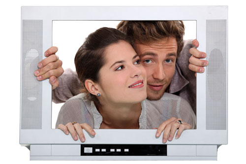 Couple inside a television set.