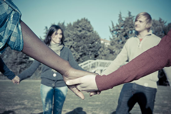 People holding hands in a circle