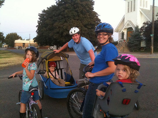 Blogger Emily Coleman, enjoying a family bike ride with her husband and three children.