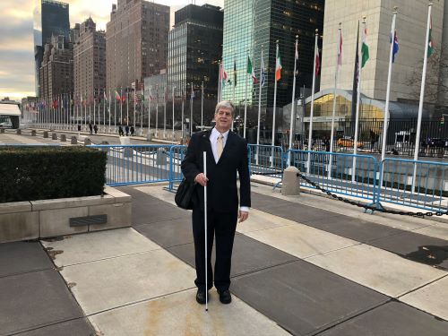 Kirk Adams standing out front of the United Nations Building.
