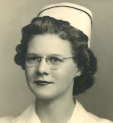 Black and white photo of Ruth Stank. She is in her mid-20s to -30s and is wearing glasses. She dressed in a nurse uniform, complete with paper hat.