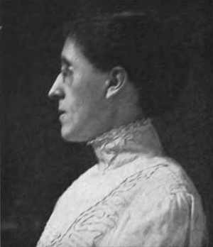 profile portrait of Adelia Hoyt in 1911, wearing a high-necked white blouse