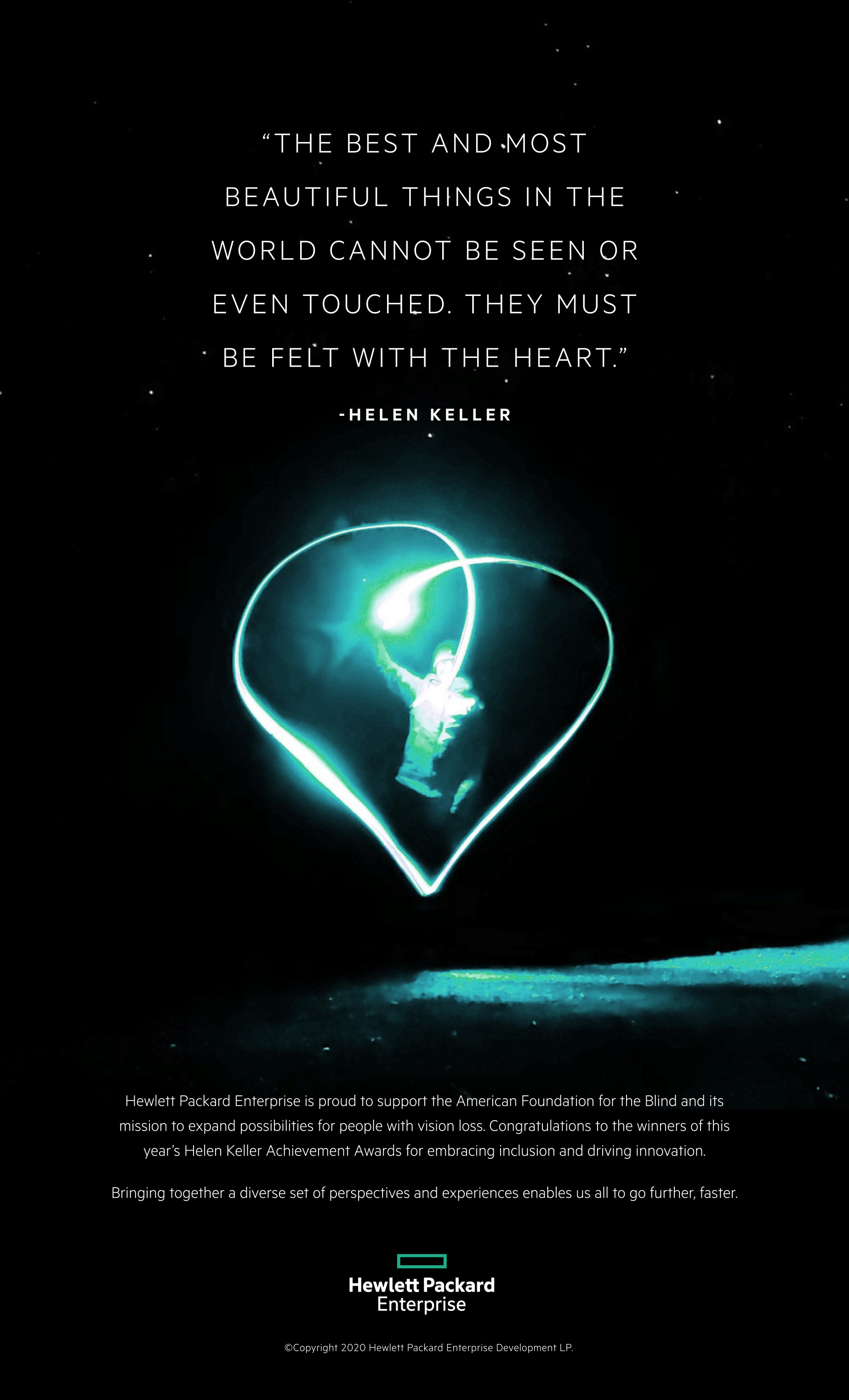 Image: A person standing in the dark, beneath a starlit sky, making an illuminated heart shape with a light.