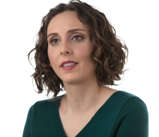 Dr. Arielle Silverman headshot. A caucasian woman with curly brown hair and brown eyes, smiling.