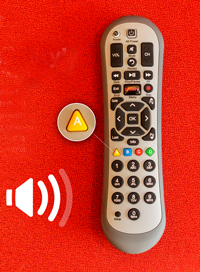 Comcast remote, with the A button highlighted, and audio description icon nearby