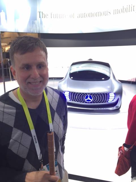 Paul Schroeder stands in front of the Mercedes self-driving concept car at the 2015 Consumer Electronics Show