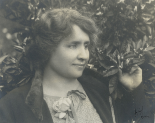 Three quarter profile of Helen Keller in Mrs. Perle's garden, 1924