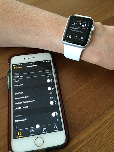 Apple Watch, modeled on wrist, with paired iPhone nearby