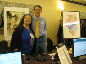 Two members of the Illinois AER standing side by side behind a table