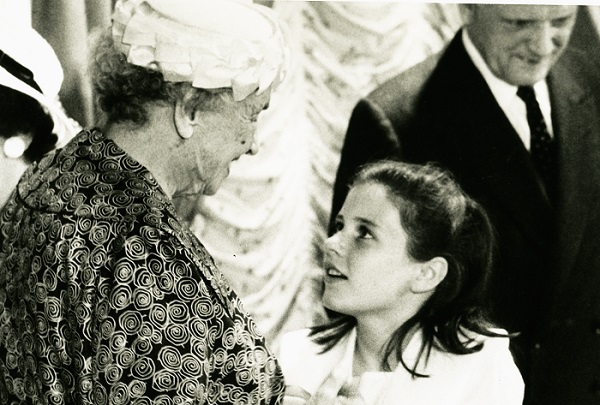 A young Patty Duke gazing up into the face of Helen Keller, 1960