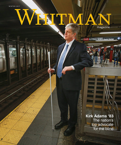 cover of Whitman Magazine showing Kirk Adams standing on the New York City subway platform, white cane in hand. The caption reads: Kirk Adams '83, the nation's top advocate for the blind.