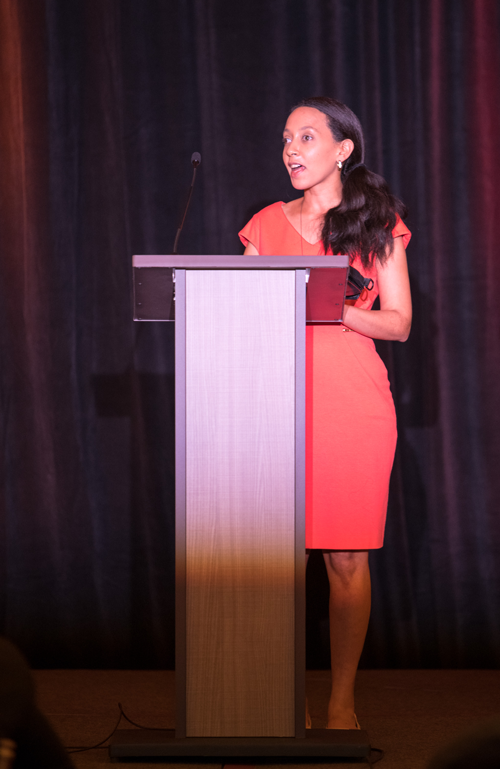 Haben Girma speaking at the podium during the 2018 HKAA.