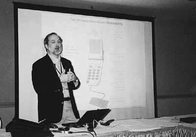Figure 2: Photograph of Gregg Vanderheiden speaking during a conference presentation.