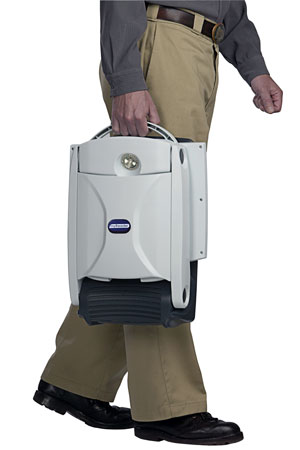 Photo of man from waist down carrying myReader folded up.