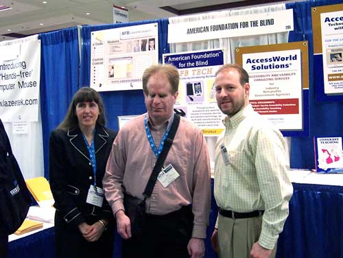 Photo of Crista Earl, Jay Leventhal, Lee Huffman in front of the AFB booth.