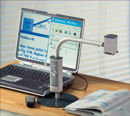 Photo of MLS Student Addition focused on a textbook and displaying a portion of the page on a laptop computer in a split-screen image with another document.
