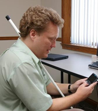 The author typing with his thumbs on the Motorola Q phone.