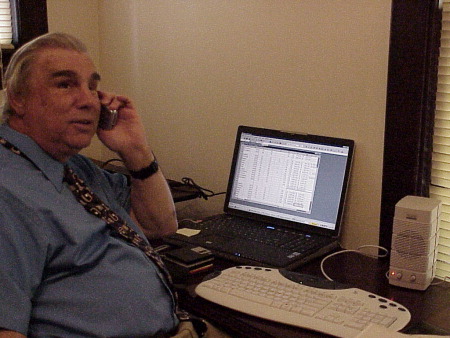 The author at his desk making a call on his Nokia 6682 cell phone.