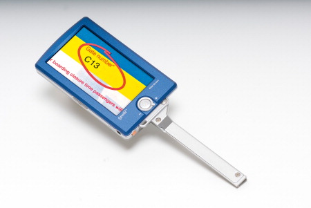 The Compact+ shown magnifying an airline boarding pass.