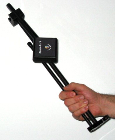 The folded Zoom-Ex being held in a man's hand.