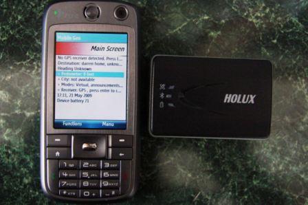A Smartphone showing the Mobile Geo main screen next to a Bluetooth GPS receiver.