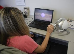Photo of the author using the Falcon and the Gravity on Planets application to explore the gravity on Mars.