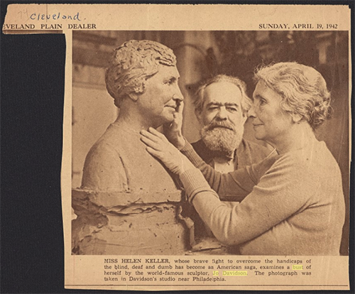 CLEVELAND PLAIN DEALER  SUNDAY, APRIL 19, 1942  MISS HELEN KELLER, whose brave fight to overcome the handicaps of the blind, deaf and dumb has become an American saga, examines a bust of herself by the world-famous sculptor, Jo Davidson. The photograph was taken in Davidson’s studio near Philadelphia.