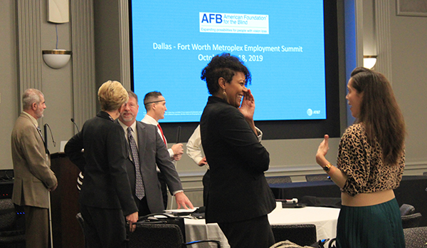 participants at the 2019 Dallas-Fort Worth Employment Summit chatting in between sessions